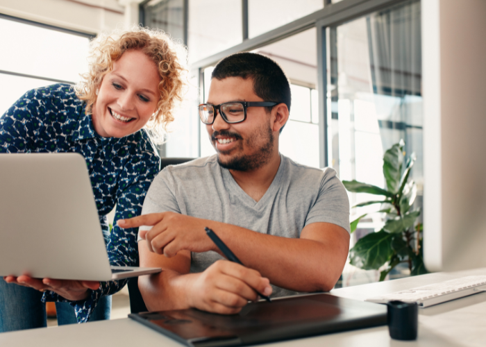 two people looking at a computer image