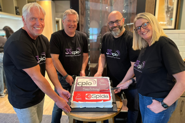 CPiO directors holding 35 year anniversary cake