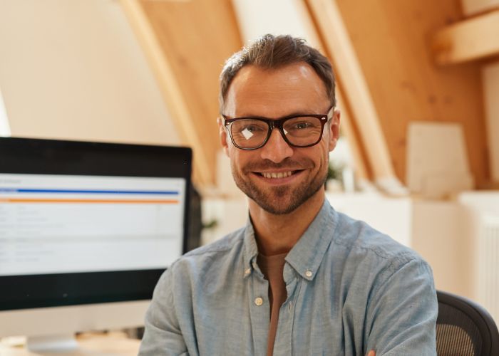 Picture of a man smiling on Sage Intacct Integration blog post